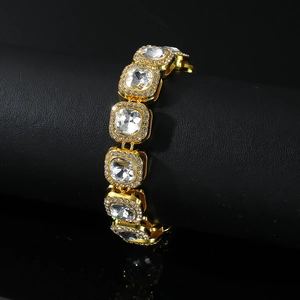 Hip hop gold bracelet featuring square clear gemstones on a black leather display