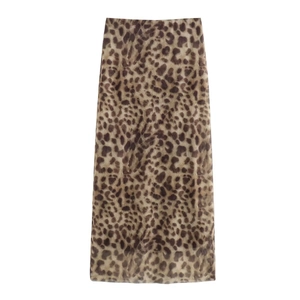 Detailed close-up of leopard print midi skirt fabric with soft chiffon texture