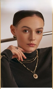 Close-up of retro 18K gold plated irregular earrings and matching tiger eye necklace