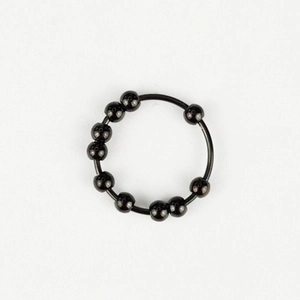 Macro shot of rotatable black beads on a stainless steel anxiety fidget ring detail