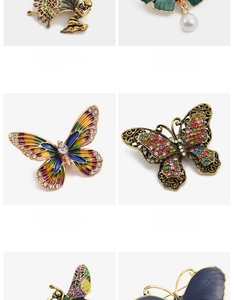 Detail view of four butterfly brooches with enamel, pearls and sparkling rhinestones