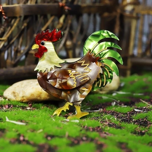 Detailed close-up of a colorful acrylic rooster brooch on a natural mossy surface