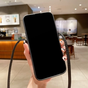 Detail of black leather iPhone case with matching adjustable crossbody lanyard strap