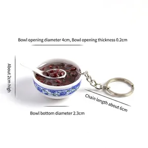 Miniature blue and white porcelain bowl keychain with red bean soup and metal ring