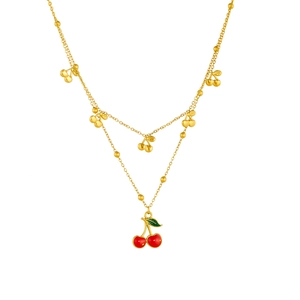 Golden double-layer stainless steel necklace with red cherry pendant on white background