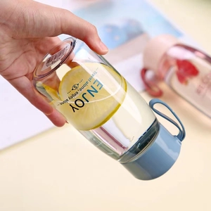 Minimalist portable clear water bottle with blue lid and carrying rope for women