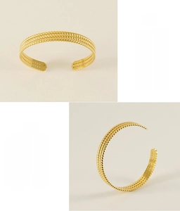 Detail of 18K gold-plated stainless steel cuff with a woven wheat pattern design
