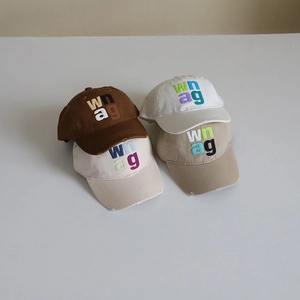Minimalist kids embroidered baseball caps in brown, white, and beige with sun protection
