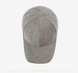 Detailed top view of grey herringbone baseball cap with metallic gold letter R logo