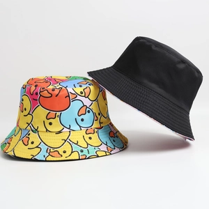 Close-up of reversible bucket hat showing colorful duck pattern and solid black fabric side