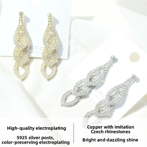 Macro detail of layered water drop earrings with claw-set crystals and S925 silver needle