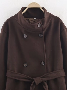 Detail of dark brown double-breasted wool coat with matching belt and size S label