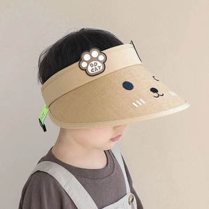Detail of cute cat embroidery and paw logo on kid's straw visor sun protection hat