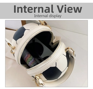 Macro view of soccer-shaped crossbody bag showing internal capacity and zip closure