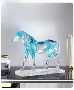 Detailed view of horse sculpture showing blue resin gradient and ice-textured base