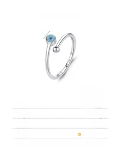 Macro detail of S925 sterling silver evil eye open ring with turquoise bead and engraving