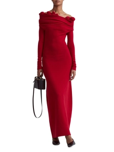 Close-up of elegant red off-shoulder knit dress showing fine texture and 3D floral detail