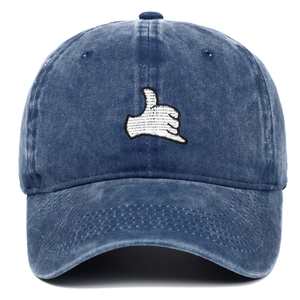 Washed blue denim baseball cap featuring white Shaka thumb gesture embroidery
