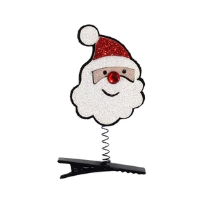 Funkelnde Weihnachtsmann Haarklammer mit Feder und roter Strassnase auf weißem Grund