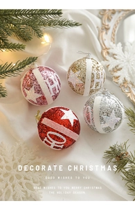 Close-up of glittery Christmas balls with star patterns in festive holiday scene
