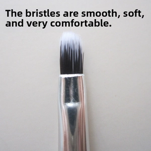 Detail of round silicone lip brush with soft gradient bristles and silver metal ferrule