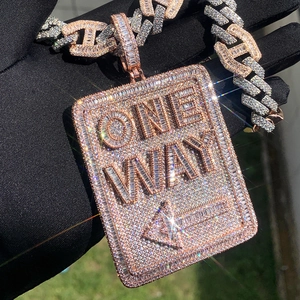 Macro shot of rose gold shield pendant with ONE WAY text and paved diamonds on cuban chain