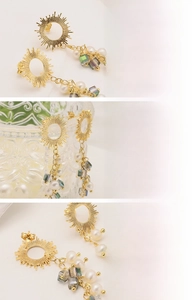 Detail of 18K gold plated sunburst earrings with natural freshwater pearls and glass beads