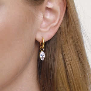 Elegant gold marquise-cut zircon hoop earrings worn by a model for a luxury style