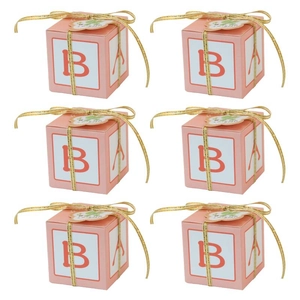 Pink cube party favors boxes with gold ribbon and baby letter blocks print for candy