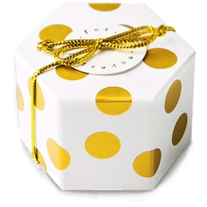 Mini hexagonal white gift box with gold foil dots and gold ribbon for chocolate