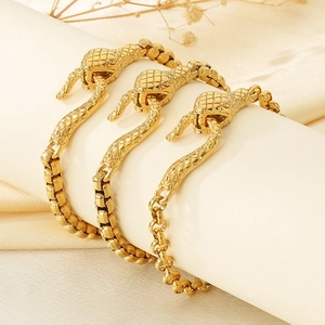 Golden snake head clasp pearl chain stainless steel bracelets on display