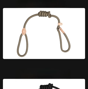 Detail view of woven beige and black P-chain dog leashes with leather joints and metal rings