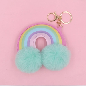 Rainbow faux leather keychain with colorful design and green fluffy pom poms