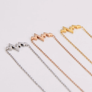 Minimalist heartbeat pendant necklaces in silver, rose gold, and gold stainless steel