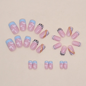 Rainbow and cow print press-on nails with blue French tips and cloud designs 24pcs