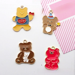 Close-up of cute alloy bear pendants with colorful enamel coating and metal loops