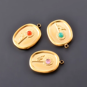 Oval stainless steel sunflower charms with red green and pink gemstone accents