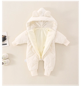 Detail of baby hooded romper with diamond quilting, bear ears and warm fleece lining