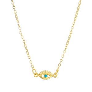 Detailed view of evil eye pendant with blue turquoise inlay on a golden O-chain