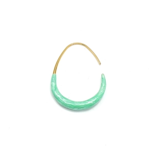 Macro detail of U-shaped gold earrings featuring mint green marble resin texture