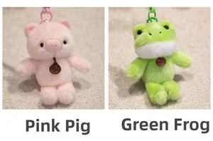 Detail view of plush pink pig and green frog keychains with fluffy texture and hooks