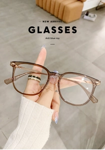 Detail view of transparent brown square anti-blue light glasses with metal temples