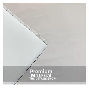 Detailed close-up showing the fine texture and precise stitching of white leather bag