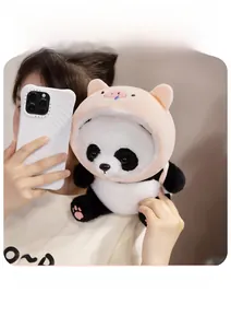 Close-up of soft panda plush toy wearing a cute pink pig hood, height 25cm detail