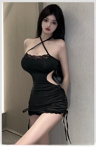 Detailed view of black halter dress with lace trim and side drawstring cut-outs