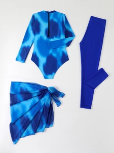 Detailed flat lay of three-piece tie-dye long sleeve swimwear set with leggings and sarong