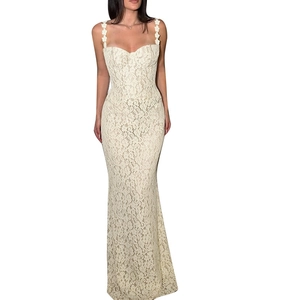 Sleeveless lace maxi dress with floral straps and elegant mermaid hemline in cream white