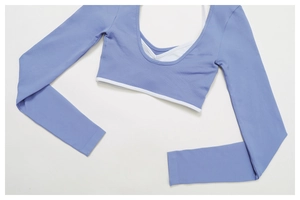 Detail of lavender yoga top with deep U-neckline and contrast white striped piping trim