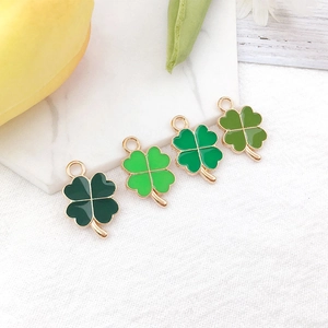 DIY four leaf clover charms in four shades of green with golden alloy frames