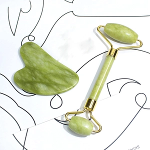 Natural green jade facial roller and gua sha set for skincare routine massage